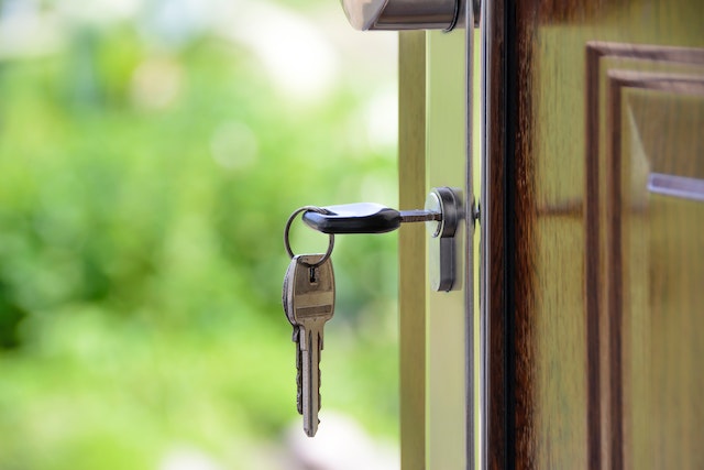 key hanging in a front door lock